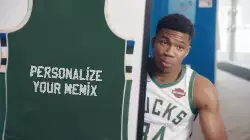 Giannis Antetokounmpo Shows Jersey In Case  