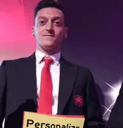Mesut Özil Holds Up Yellow Card 