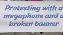 Protesting with a megaphone and a broken banner meme