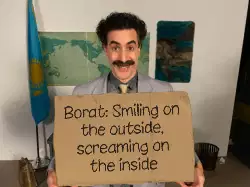Borat: Smiling on the outside, screaming on the inside meme
