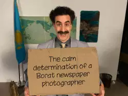 The calm determination of a Borat newspaper photographer meme