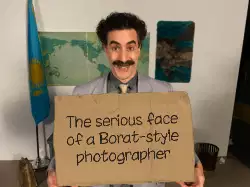 The serious face of a Borat-style photographer meme
