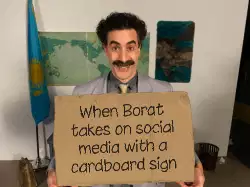 When Borat takes on social media with a cardboard sign meme