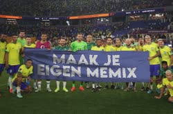 Brazil Soccer Team Holds Up Banner 