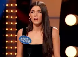 Charli D'Amelio's shocked face in the stage decorations when her sister won Celebrity Family Feud meme