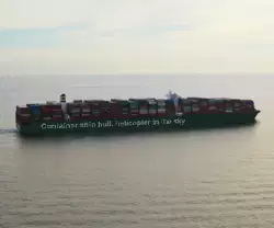 Container ship hull, helicopter in the sky meme