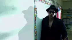Daddy Yankee Leans Against White Board 