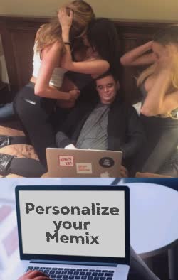 Man Surronded By Women Looks At Computer 