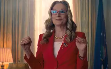 Red blazer, badge, ring, eye glasses, watch glasses, US Presidential pin, necklace, flag of the President, curtains, lamp, flag table lamp, curtain, gesturing, talking, expecting - all in a day's work for President Orlean meme