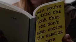When you're so into the book that you don't even notice the passing cars meme