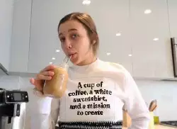 A cup of coffee, a white sweatshirt, and a mission to create meme