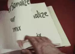 Person Flips Pages of A Book 