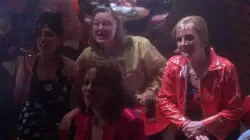 A Group Of Women Cheer In Club 