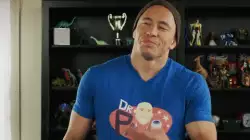 Georges St-Pierre staring and gesturing after unboxing his new t-shirt meme