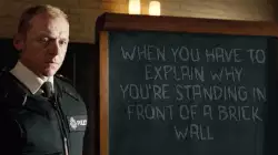 When you have to explain why you're standing in front of a brick wall meme