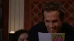 Ryan Reynolds Reads Card Intently 