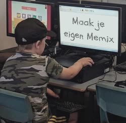 Small Kid Looks At Computer 