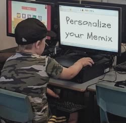 Small Kid Looks At Computer 