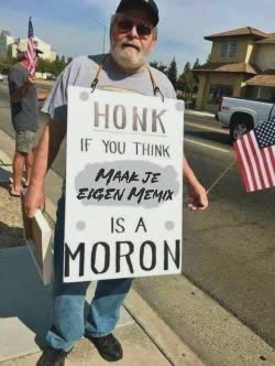 Old Man Wears A Sign 