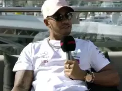 Lewis Hamilton Holds Up Sign 