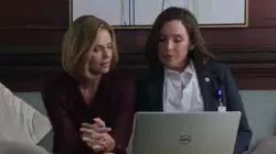 Two Women Look At Computer 