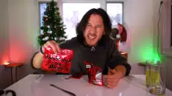 Markiplier Holds Up Sparkly Red Package 