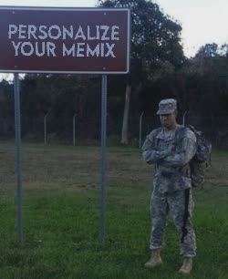 A Soldier Stands Under Highway Sign 