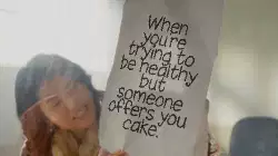 When you're trying to be healthy but someone offers you cake. meme