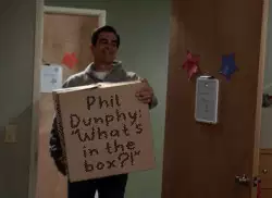 Phil Dunphy: "What's in the box?!" meme