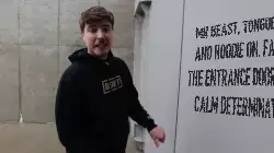 Mr Beast, tongue out and hoodie on, facing the entrance door with calm determination meme