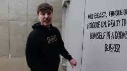 Mr Beast, tongue out and hoodie on, ready to prove himself in a doomsday bunker meme