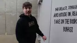 Mr Beast, tongue out and hoodie on, ready to take on the doomsday bunker meme