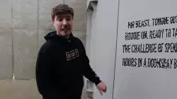 Mr Beast, tongue out and hoodie on, ready to take on the challenge of spending 24 hours in a doomsday bunker meme