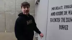 Mr Beast, tongue out and hoodie on, waiting to enter the doomsday bunker meme