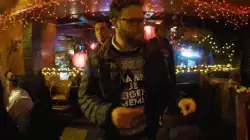 Seth Rogen Points To His Cool Sweater 