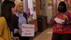 Leslie Knope Holds Sign In Office 