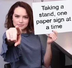 Taking a stand, one paper sign at a time meme