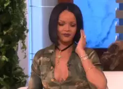 Rihanna Holds Up Blue Sign 