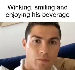 Winking, smiling and enjoying his beverage meme