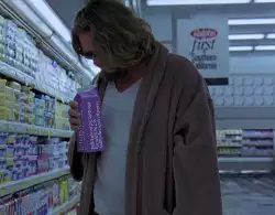 Jeff Lebowski looking for milk in his bathrobe and slippers meme