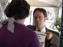 Dwight Shows Woman Piece Of Paper 