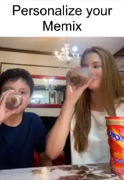 A Boy Drinks Juice WIth Sister 