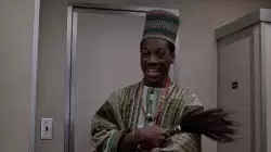 Eddie Murphy Raises Hands Up And Laughs 