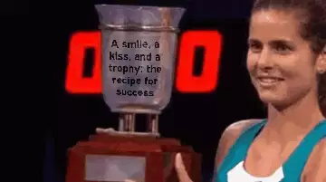 A smile, a kiss, and a trophy: the recipe for success meme