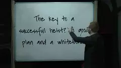 The key to a successful heist? A good plan and a whiteboard meme
